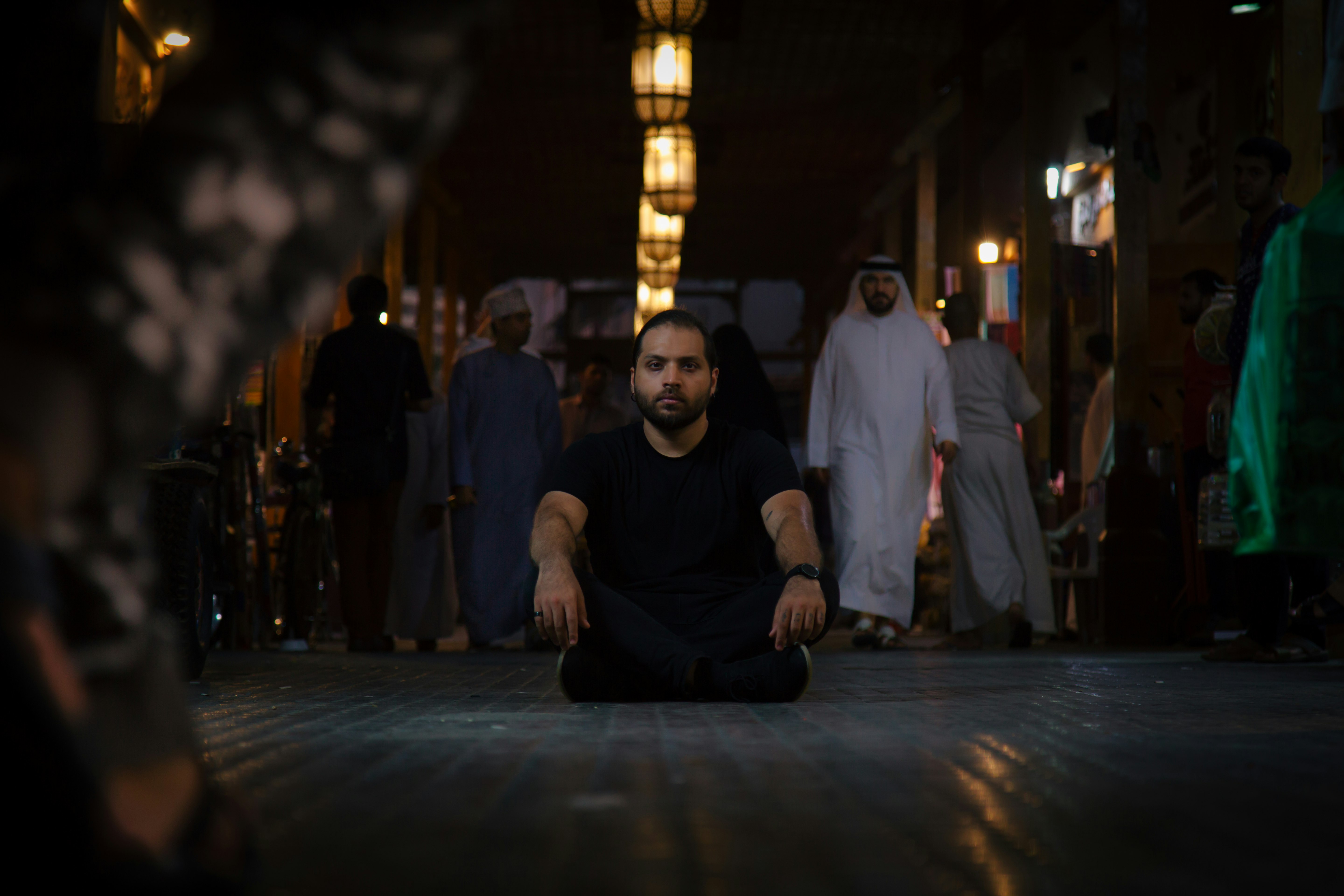 man sitting in the middle of the road